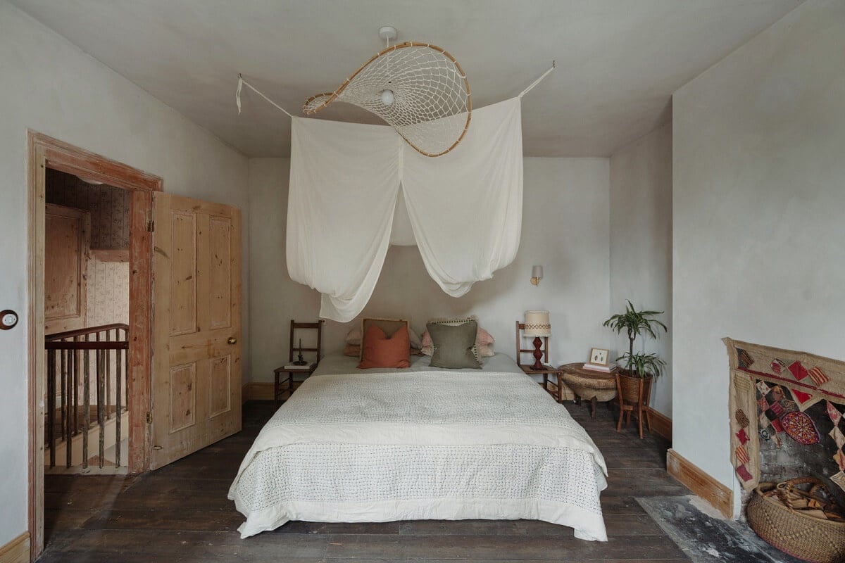 Pared Back Interiors in an English Home in Kent 19 canopy above bed