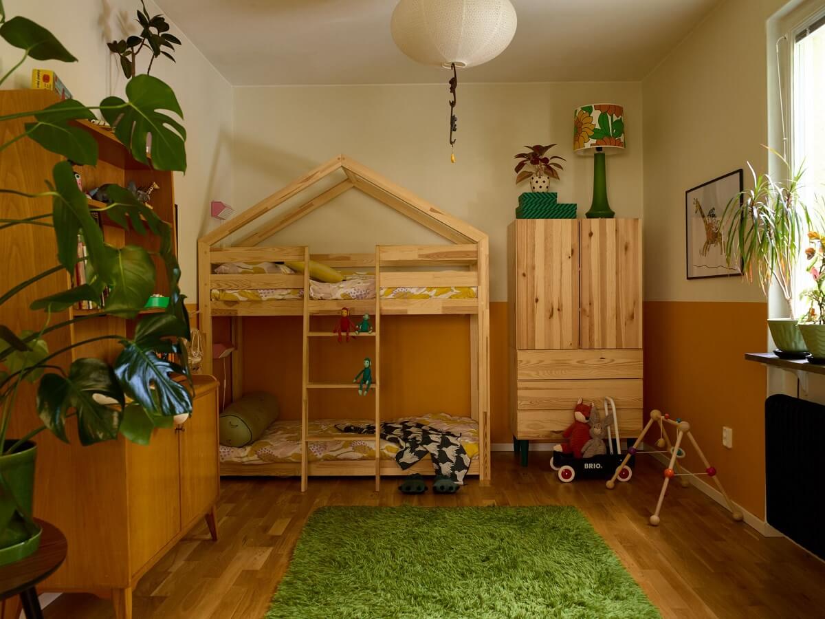 A Charming and Cozy Midcentury Family Apartment in Sweden 22 childrens bedroom with half painted wall nordroom