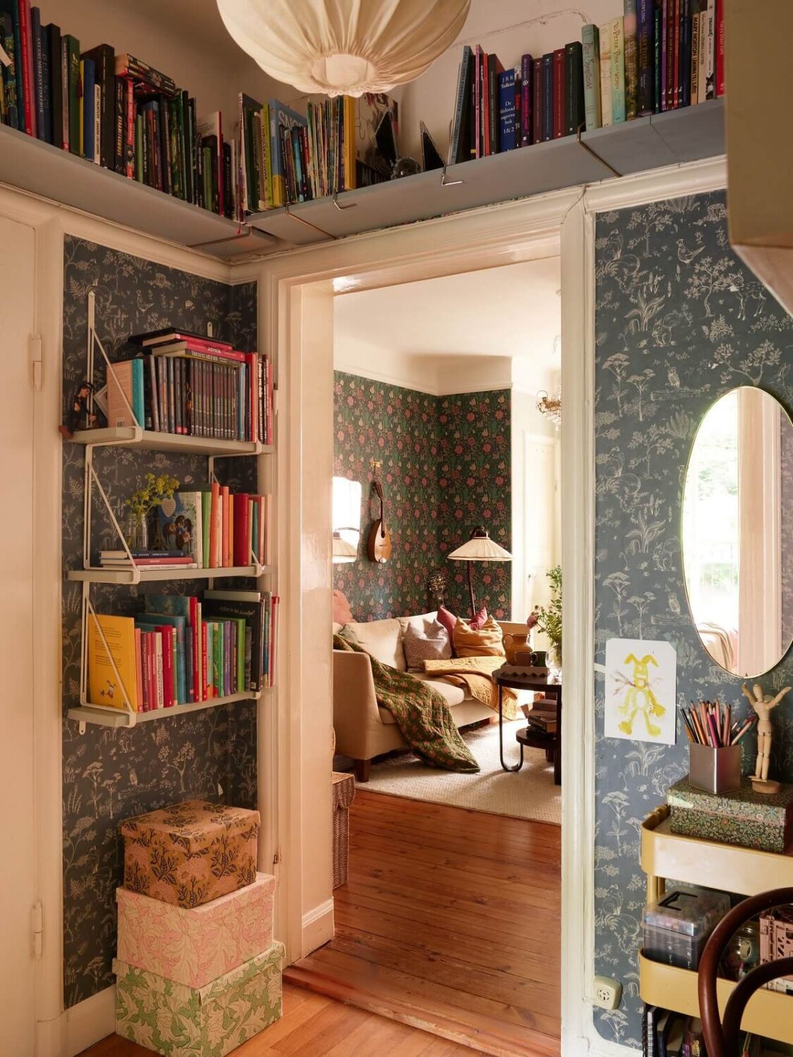 A Cozy 1920s Apartment with Original Details and Wallpaper 26 childrens room with bookshelves above door and blue wallpaper nordroom