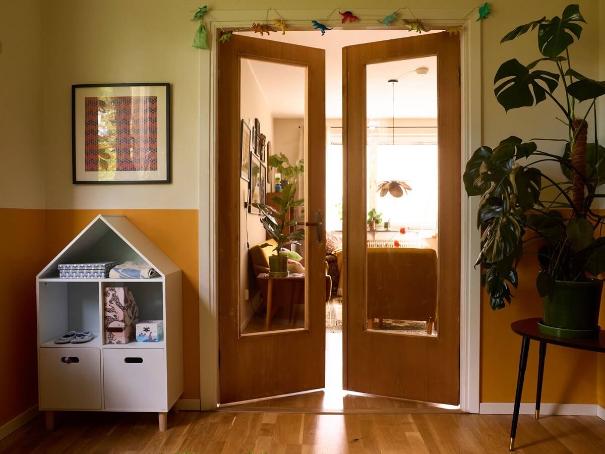 A Charming and Cozy Midcentury Family Apartment in Sweden 23 childrens room with double glass doors