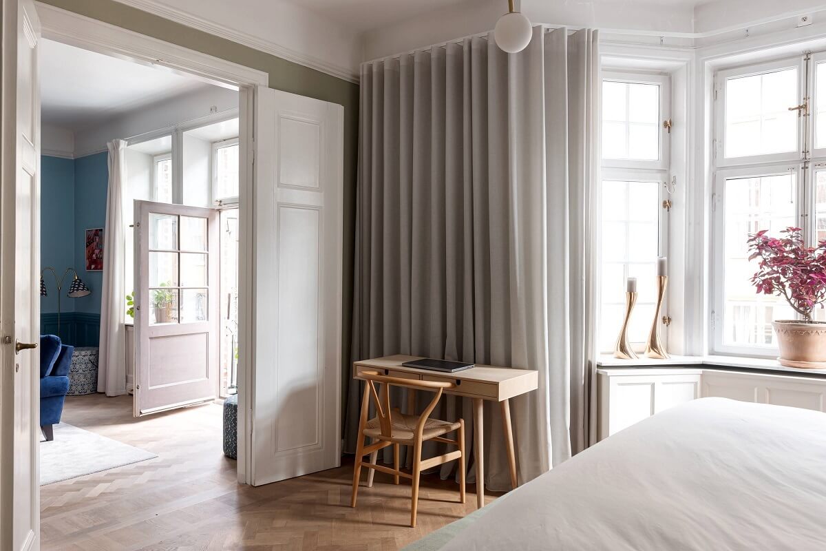 A Classic Apartment with a Blue Living Room 14 classic bedroom with wooden desk