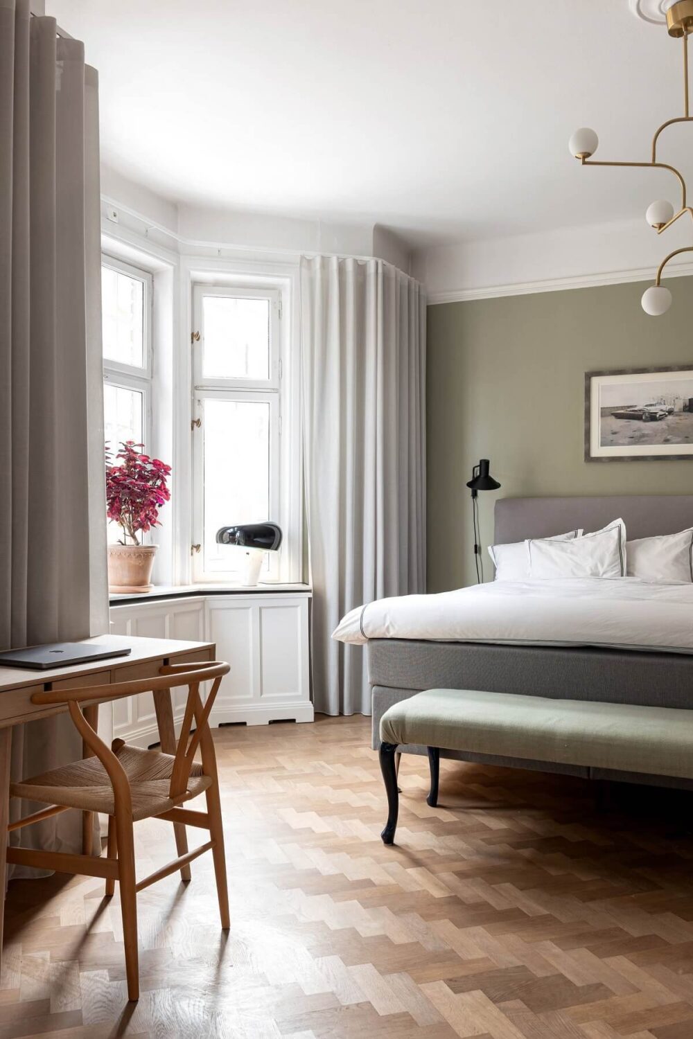 A Classic Apartment with a Blue Living Room 13 classic hotel style bedroom with bay window and parquet floor nordroom