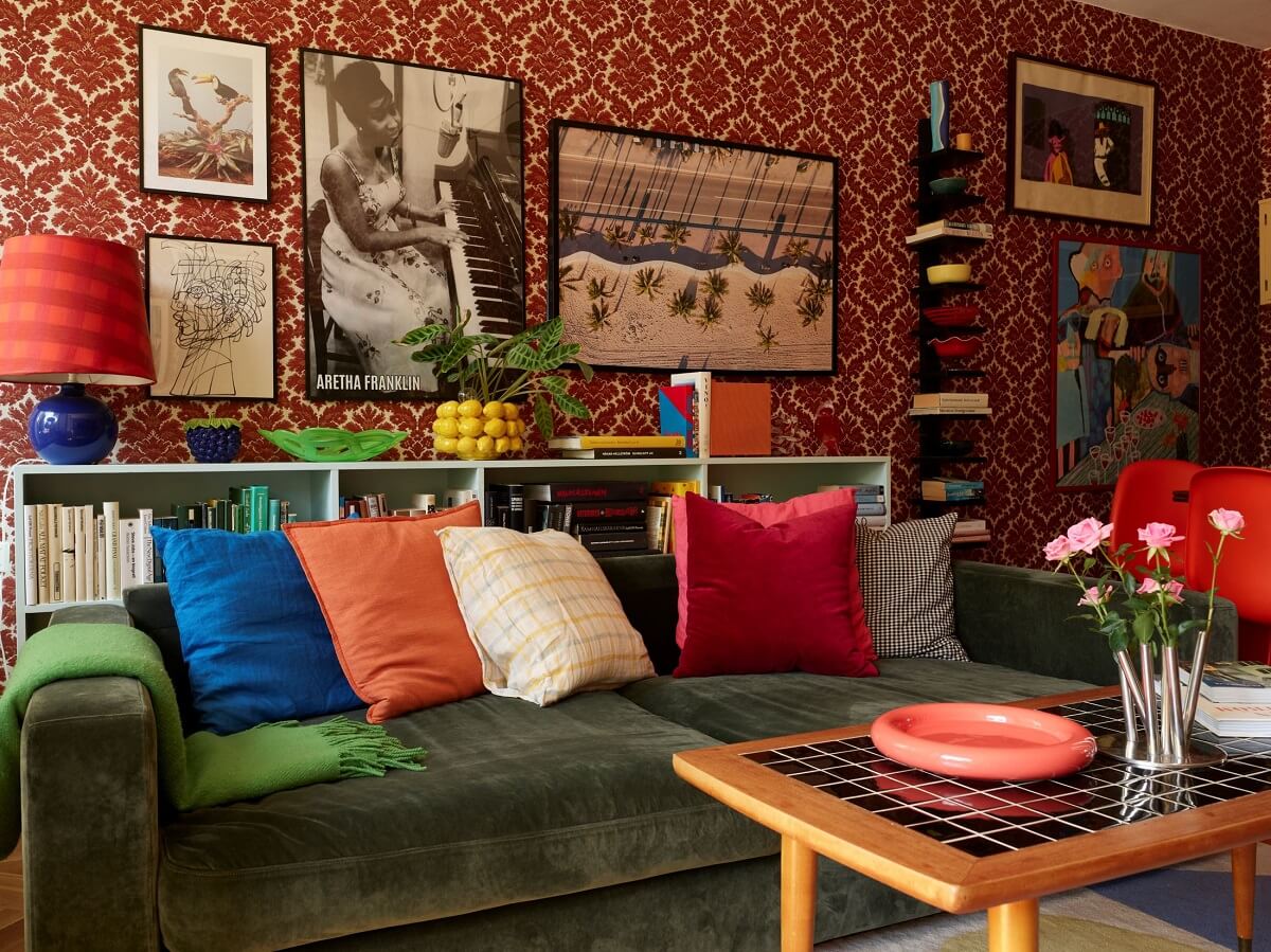 A Colorful Swedish Apartment Inspired by the 50s and 70s 11 colorful living room with green sofa and red wallpaper nordroom