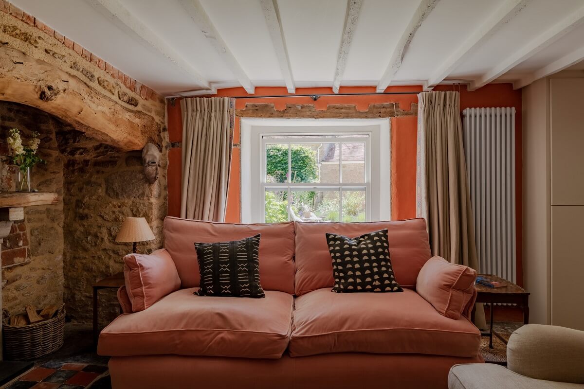 A Charming English Cottage with Historic Details 3 cottage living roomwith pink sofa
