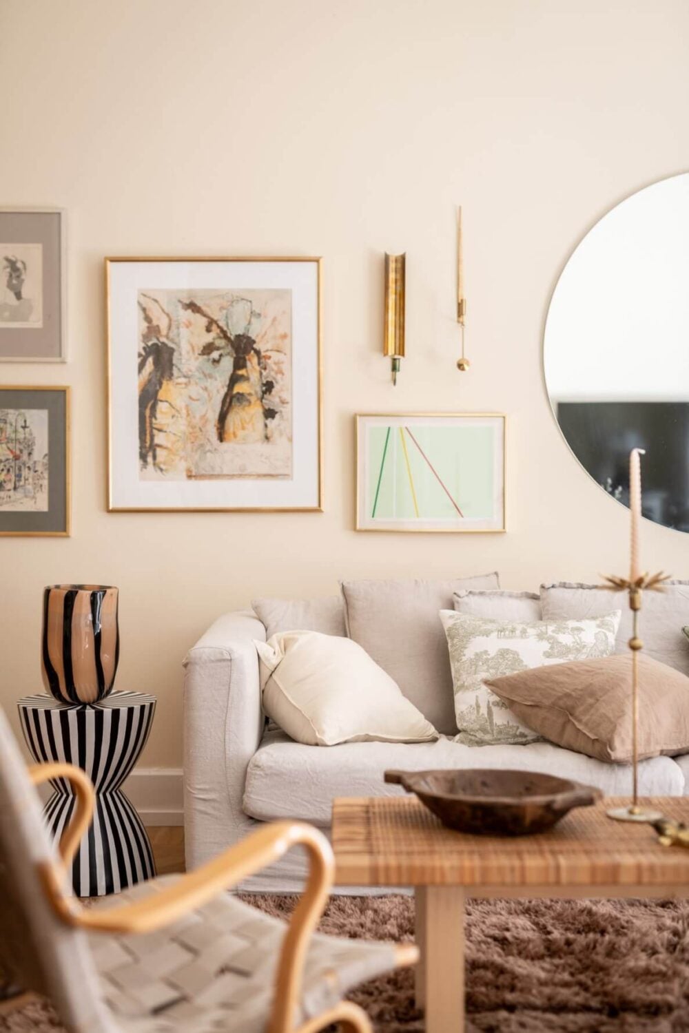 A Scandinavian Apartment with a Pale Yellow Living Room 5 cozy beige living room with artwork