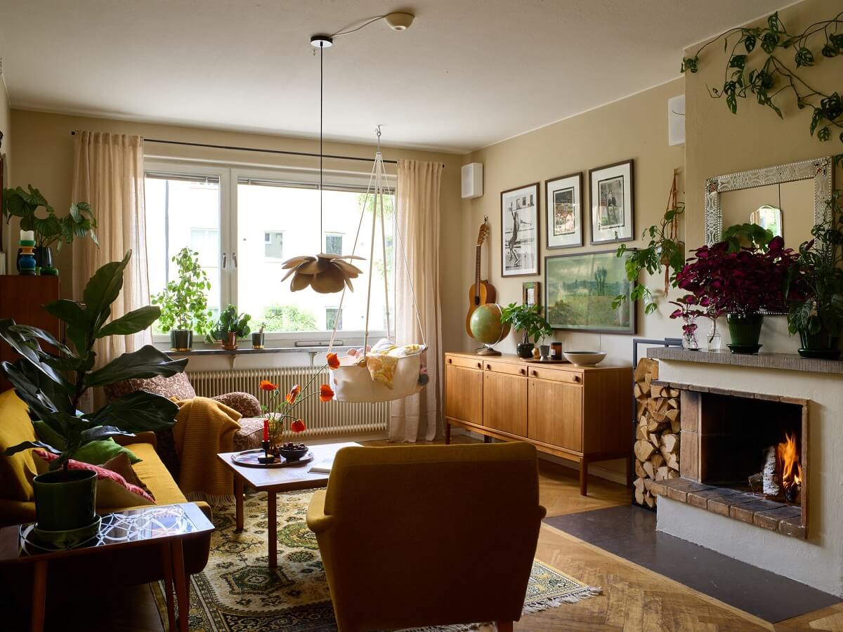 A Charming and Cozy Midcentury Family Apartment in Sweden 1 cozy midcentury vintage living room with fireplace nordroom
