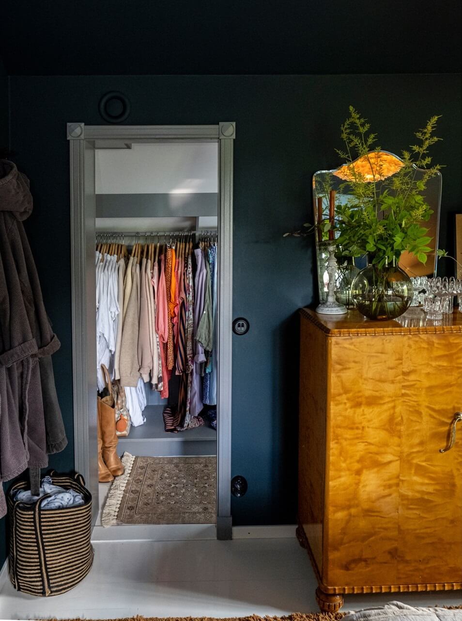A White Swedish Villa with a Veranda and a Swimming Pool 15 dark blue bedroom walk in closet