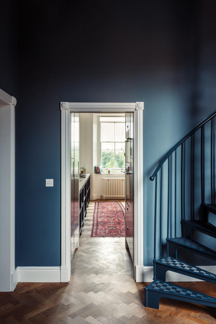 A London Duplex Apartment with a Purple Kitchen 5 dark blue hallway