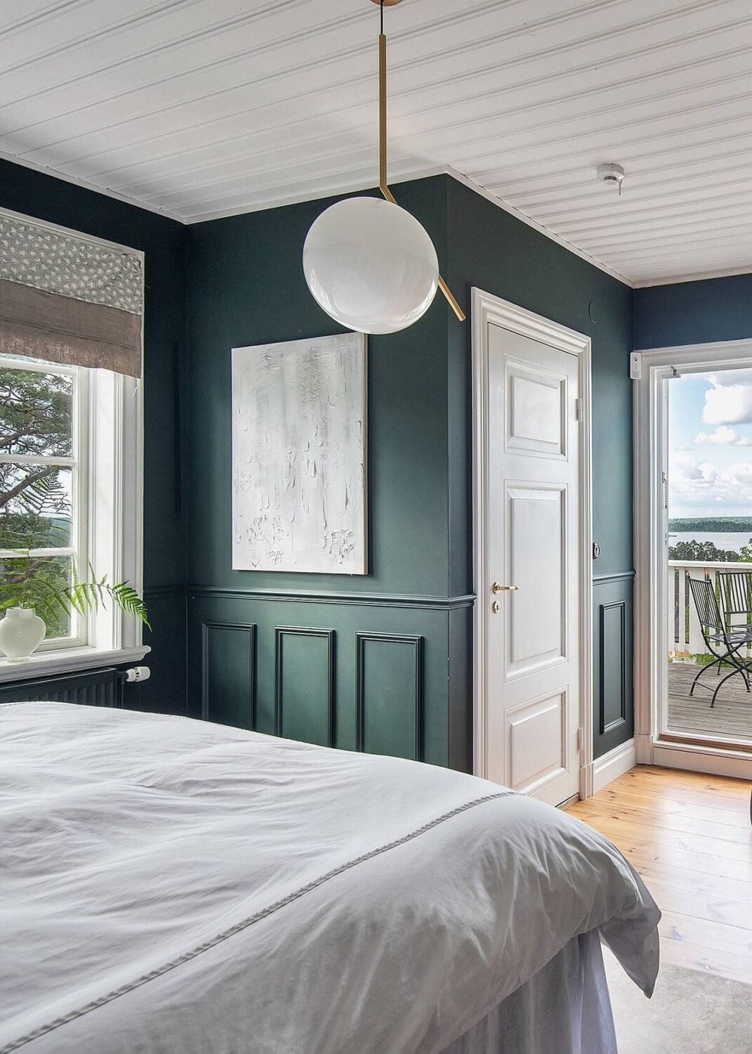 A Yellow Swedish Villa with Views of the Sea 13 dark blue master bedroom