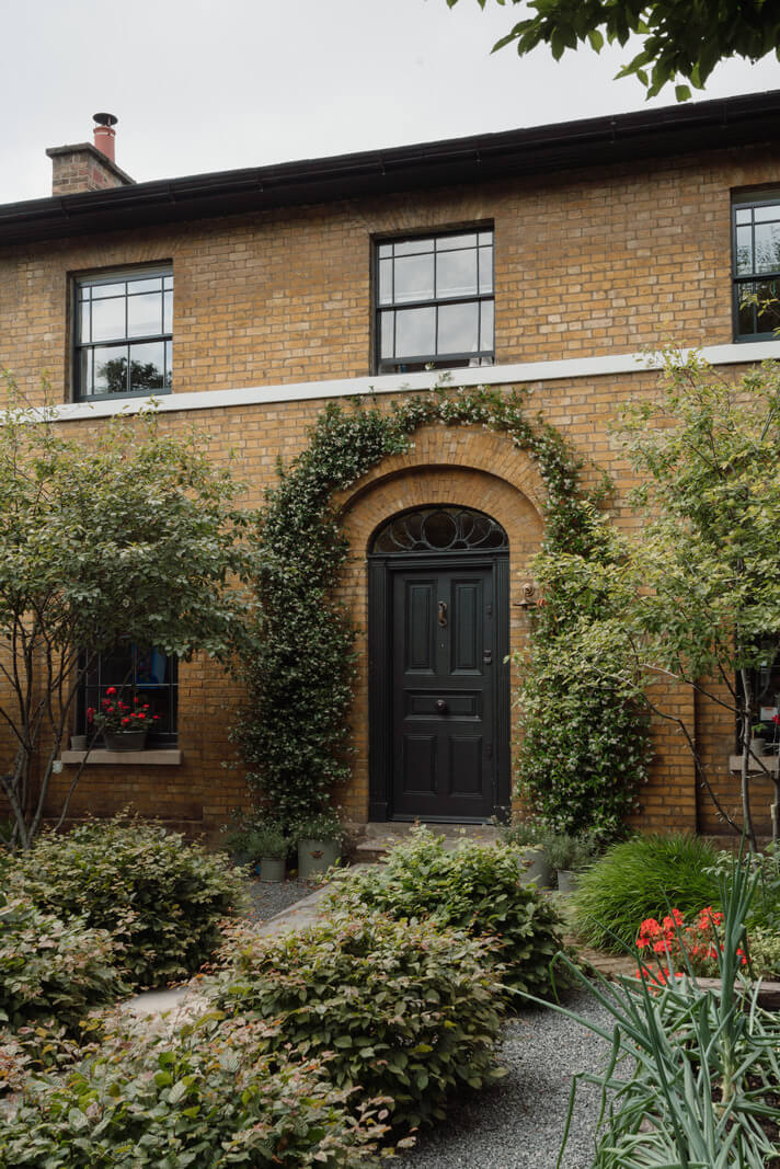 A Beautiful London Family Home with Colorful Accents 29 dark green front door english family house nordroom