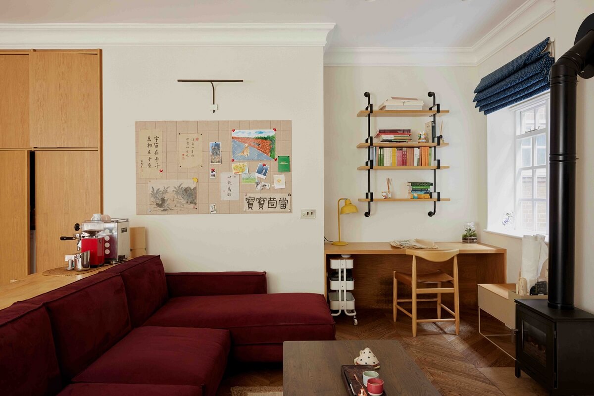 An Apartment with Rich Colors and Modern Design in a Victorian Mansion 6 deep red couch and desk in living room