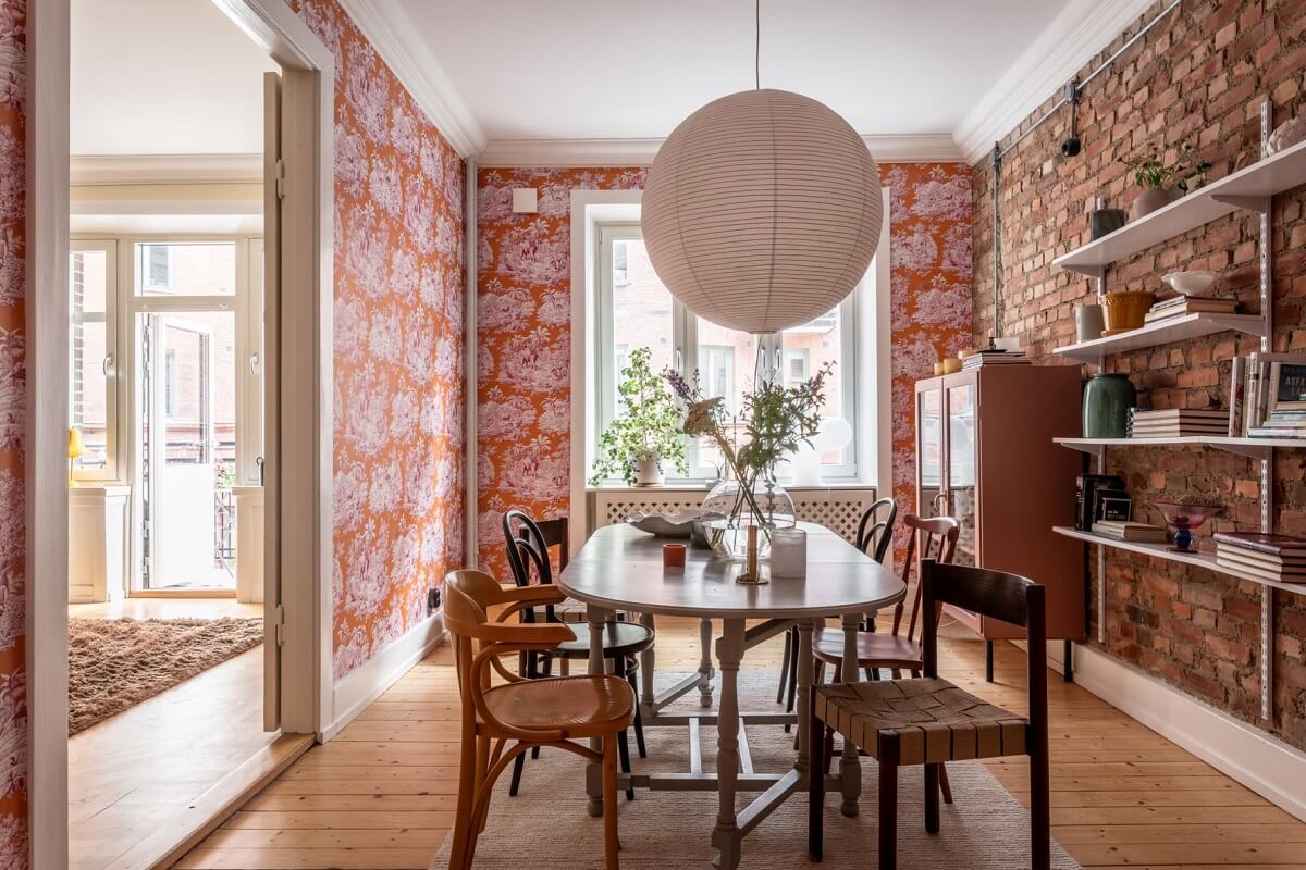 A Scandinavian Apartment with a Pale Yellow Living Room 10 dining room with brick wall and wallpaper