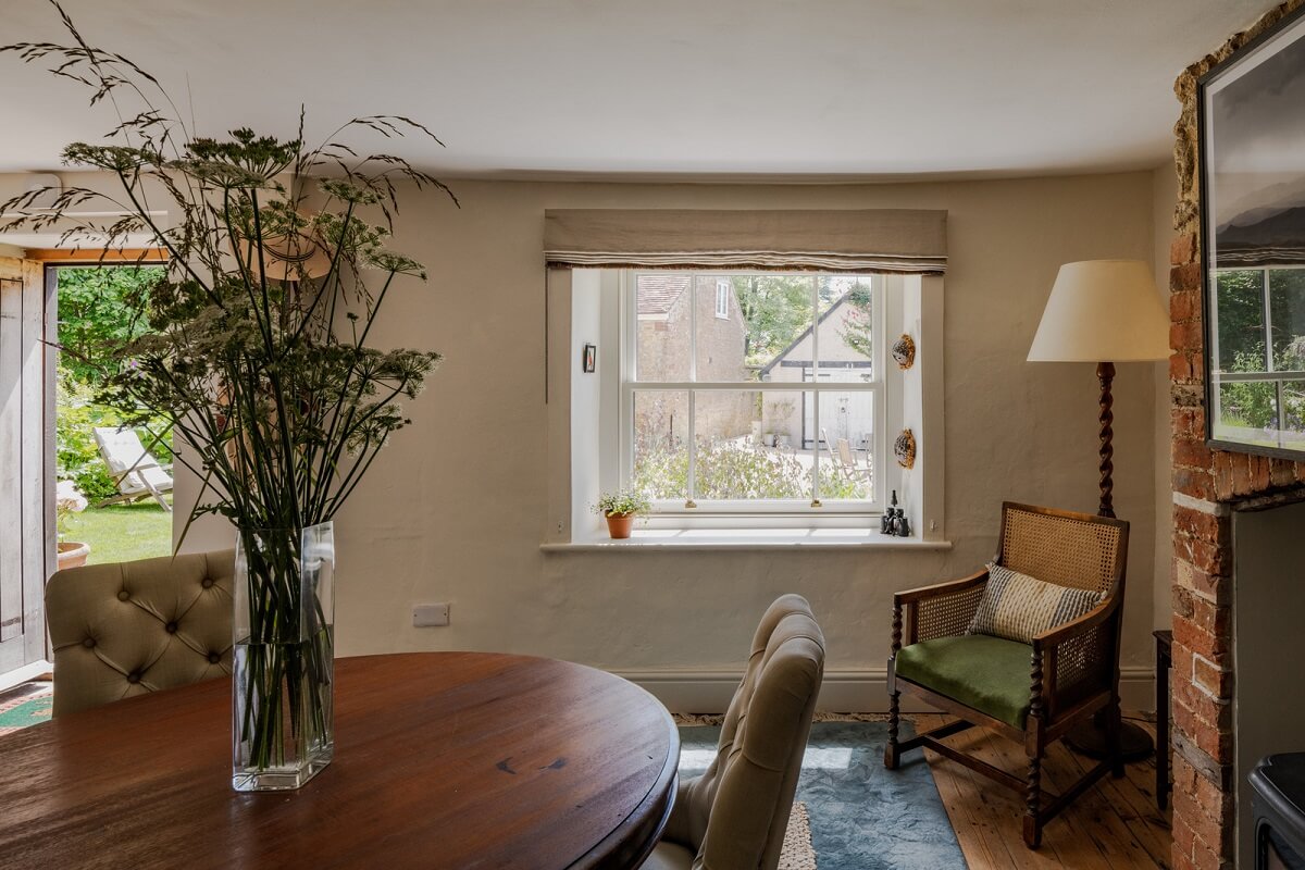 A Charming English Cottage with Historic Details 7 dining room with round table