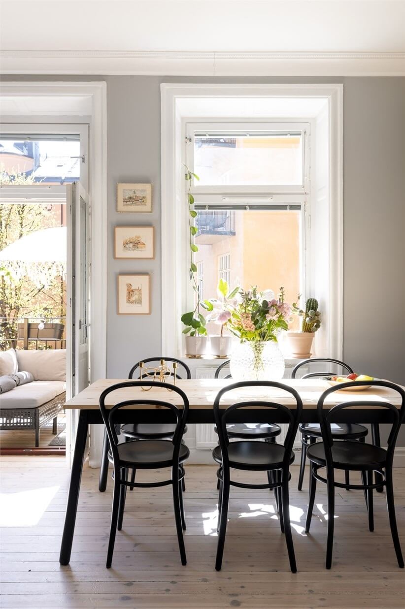 A Lovely Stockholm Apartment with a Black Kitchen and Pink Bedroom 17 dining table