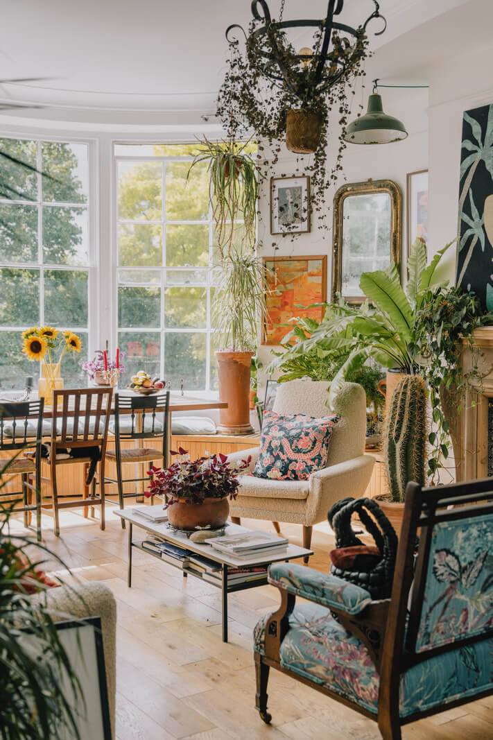 Plants, Art, and a Huge Bay Window in a London Apartment 3 eclectic living room with plants art and large windows nordroom