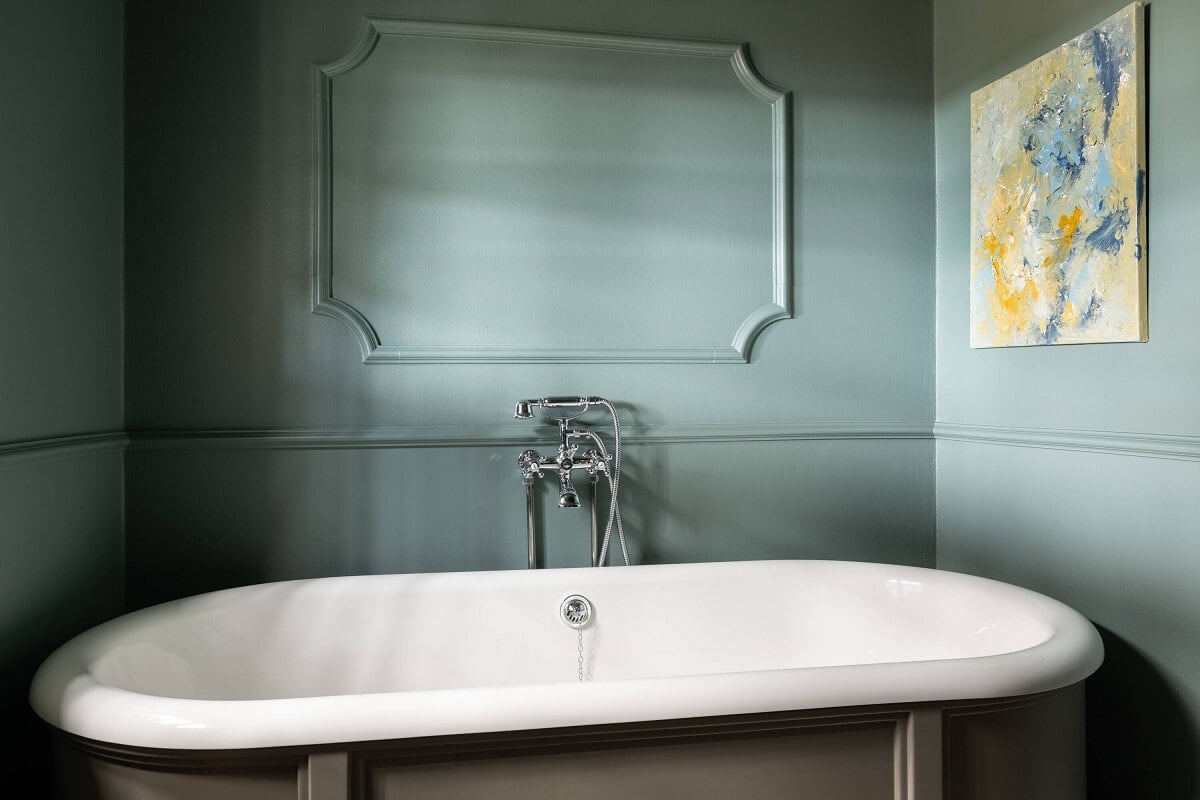 A Yellow Swedish Villa with Views of the Sea 22 freestanding bath with bluegreen wall