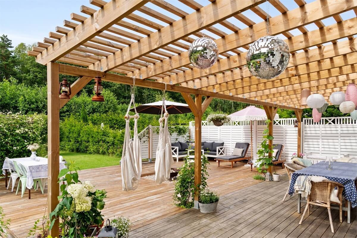 A Bright Open-Plan Swedish Home with a Pink Kitchen 25 garden deck with pergola