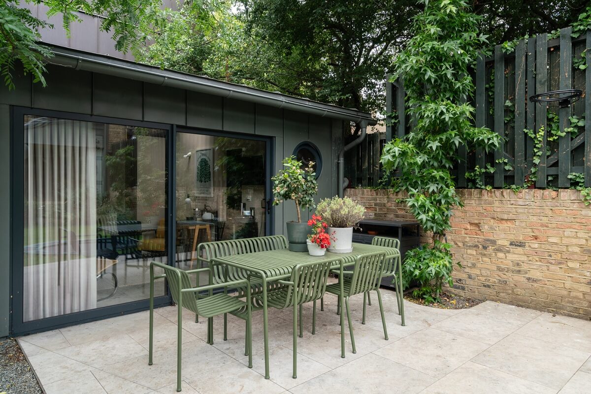 A Beautiful London Family Home with Colorful Accents 26 garden dining table