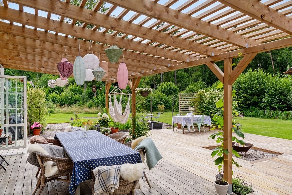 A Bright Open-Plan Swedish Home with a Pink Kitchen 24 garden with pergola