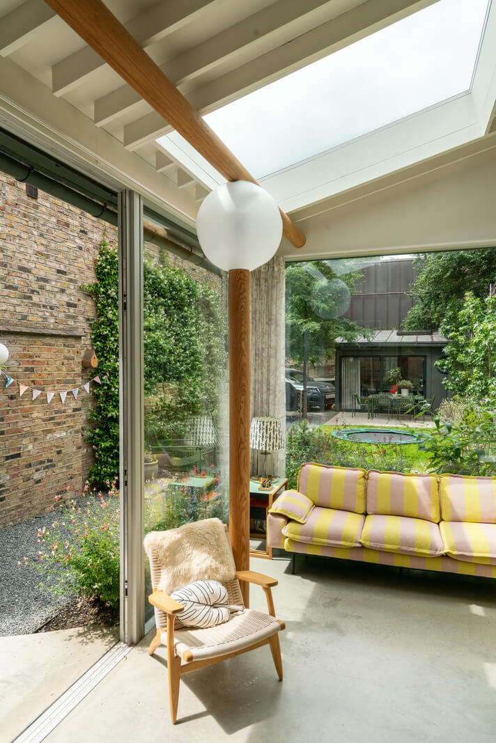 A Beautiful London Family Home with Colorful Accents 11 glass extension garden room nordroom