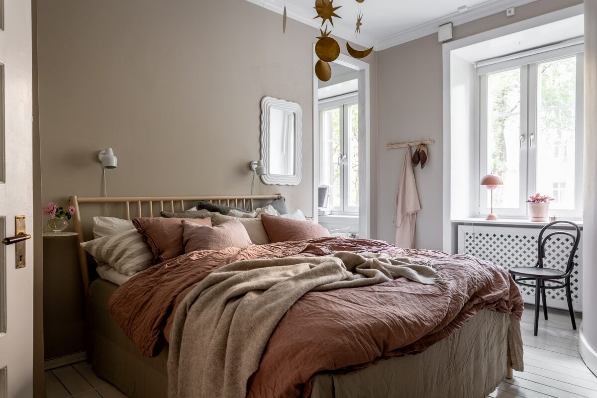 A Scandinavian Apartment with a Pale Yellow Living Room 19 gray bedroom pink bedding