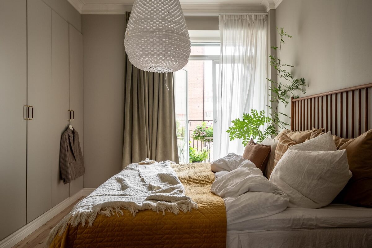 A Spacious Renovated Apartment with a Light Pink Living Room 17 gray bedroom with floor to ceiling wardrobes and pink color accent