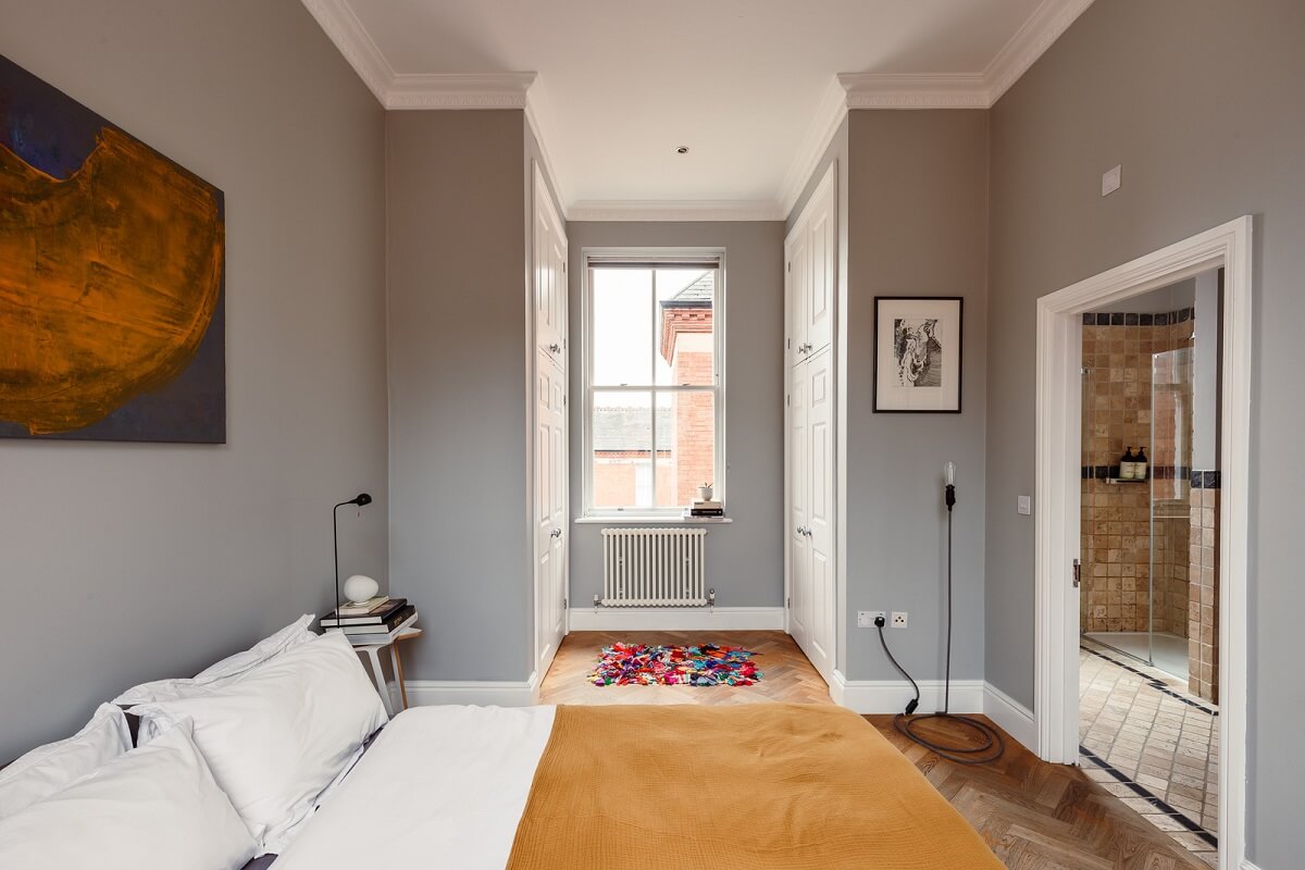 A London Duplex Apartment with a Purple Kitchen 10 gray bedroom with ochre yellow color accent