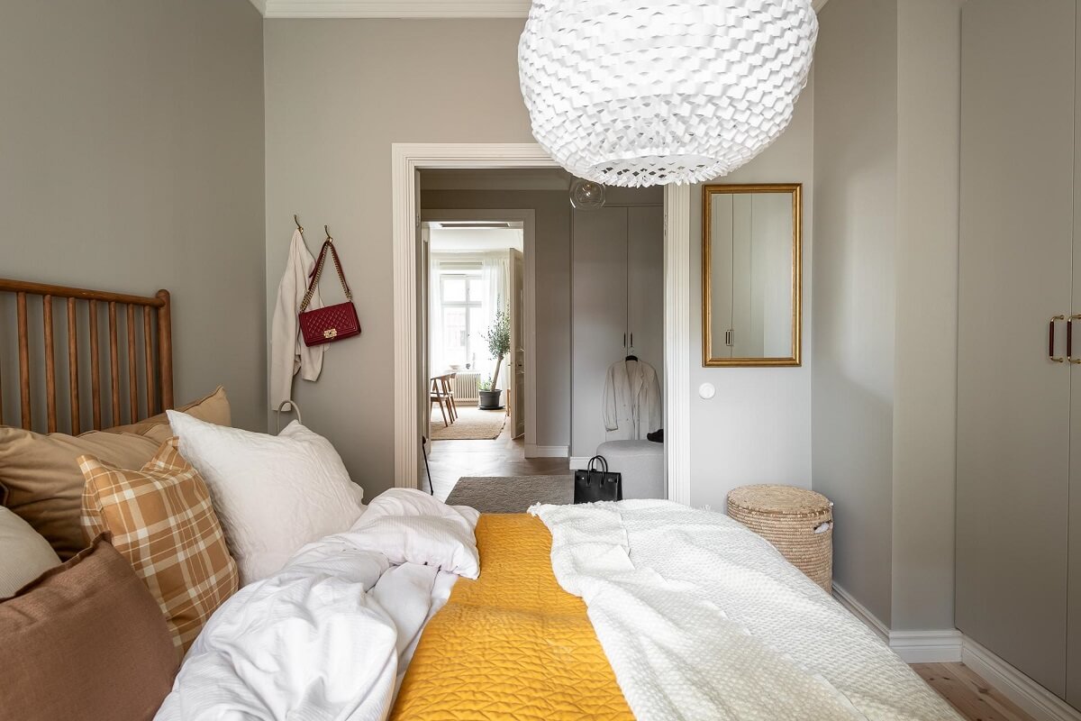 A Spacious Renovated Apartment with a Light Pink Living Room 22 gray bedroom with wardrobes