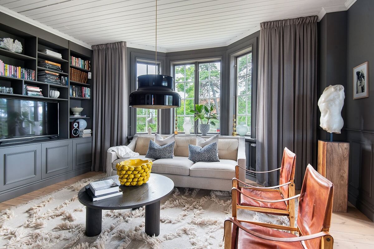 A Yellow Swedish Villa with Views of the Sea 3 gray living room with bay window