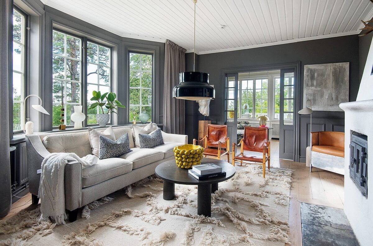A Yellow Swedish Villa with Views of the Sea 2 gray living room with large rug