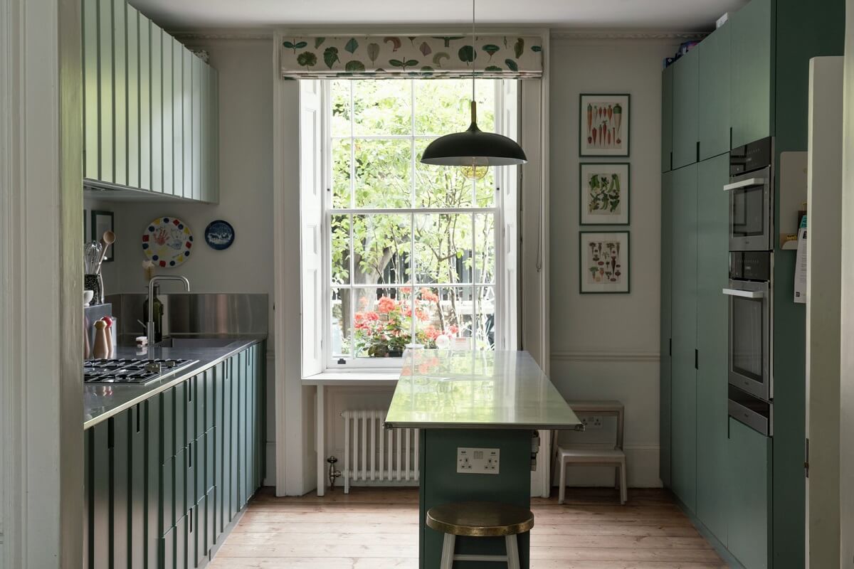 A Beautiful London Family Home with Colorful Accents 8 green kitchen with island