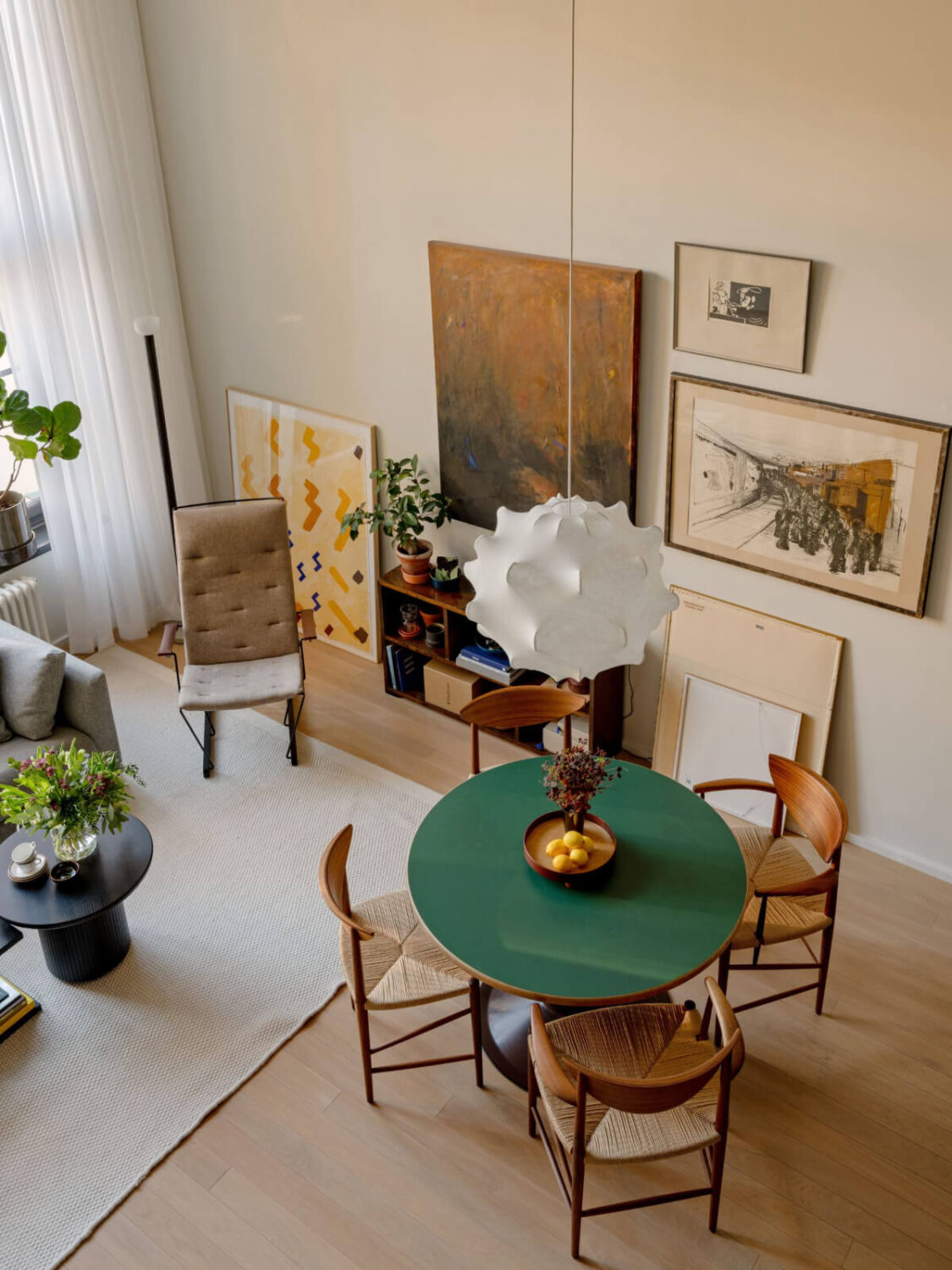 A Monochrome Loft with High Ceilings and Art 14 green top round dining table