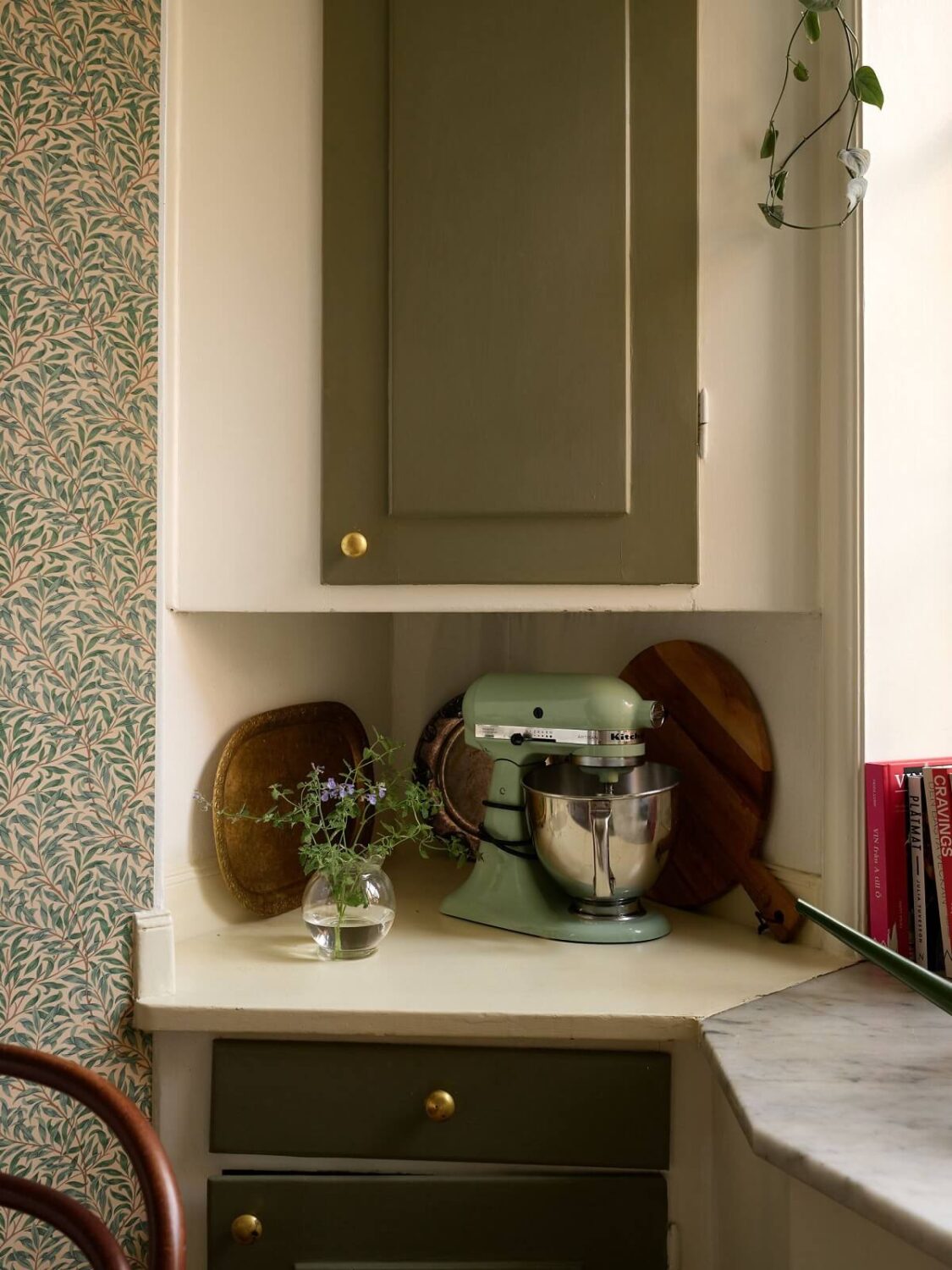 A Cozy 1920s Apartment with Original Details and Wallpaper 12 green vintage cabinets kitchen