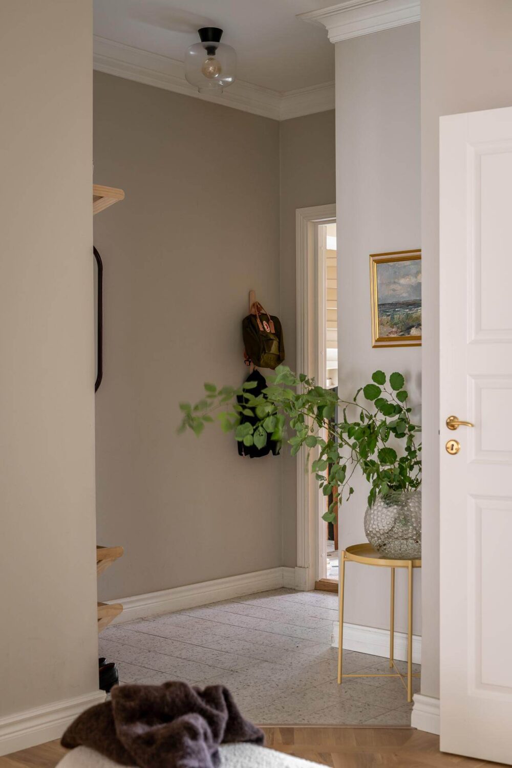 A Spacious Renovated Apartment with a Light Pink Living Room 29 hallway with floor tiles