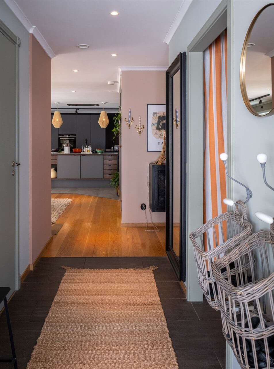 A White Swedish Villa with a Veranda and a Swimming Pool 11 hallway with storage baskets nordroom