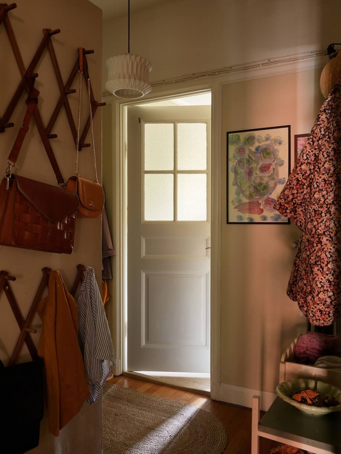 A Cozy 1920s Apartment with Original Details and Wallpaper 32 hallway with wall hooks A Cozy 1920s Apartment with Original Details and Wallpaper