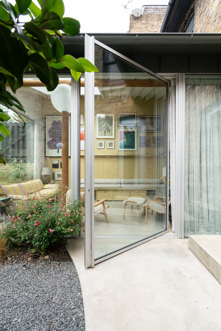 A Beautiful London Family Home with Colorful Accents 13 huge glass door extension garden room nordroom