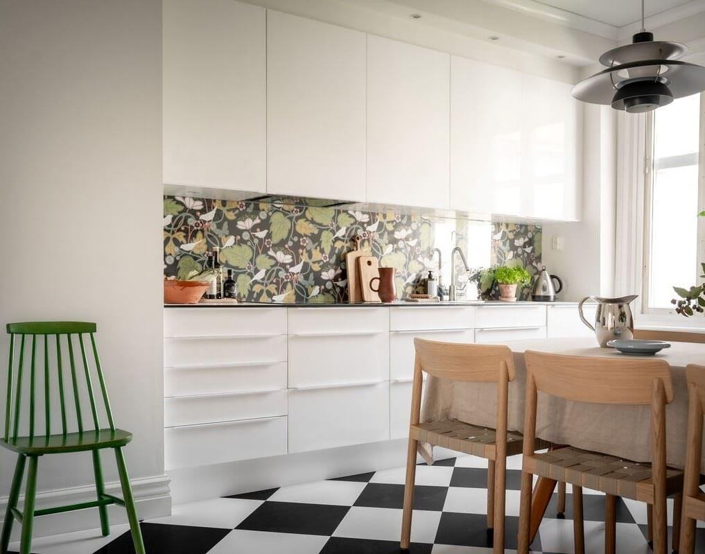 A Bright Swedish Apartment with Subtle Color Accents 10 kitchen checkerboard floor wallpaper splashback nordroom