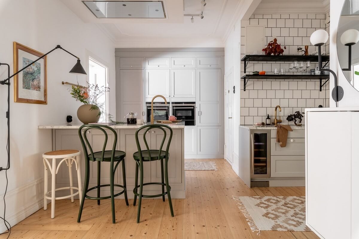 A Scandinavian Apartment with a Pale Yellow Living Room 14 kitchen light gray cabinets whit tiles