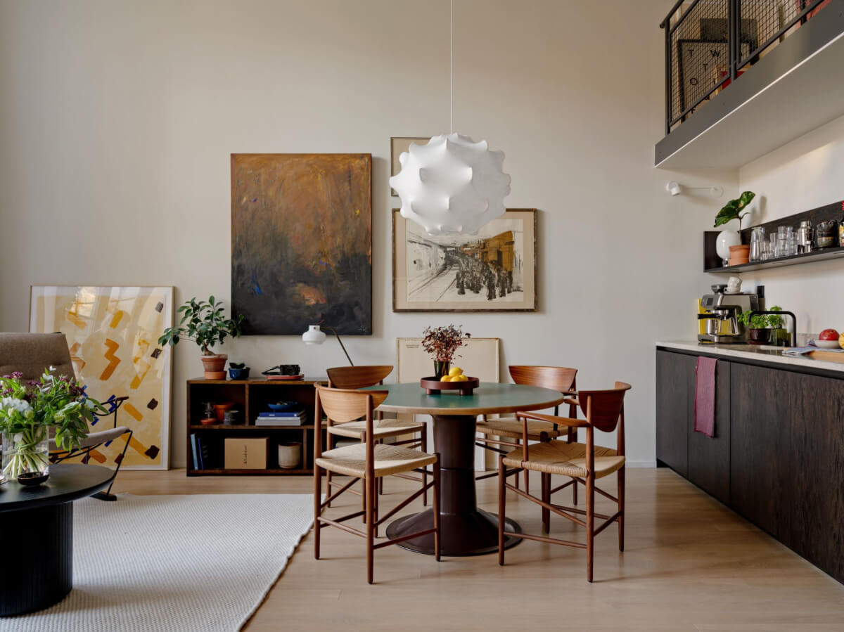 A Monochrome Loft with High Ceilings and Art 20 kitchen living room with round table and art