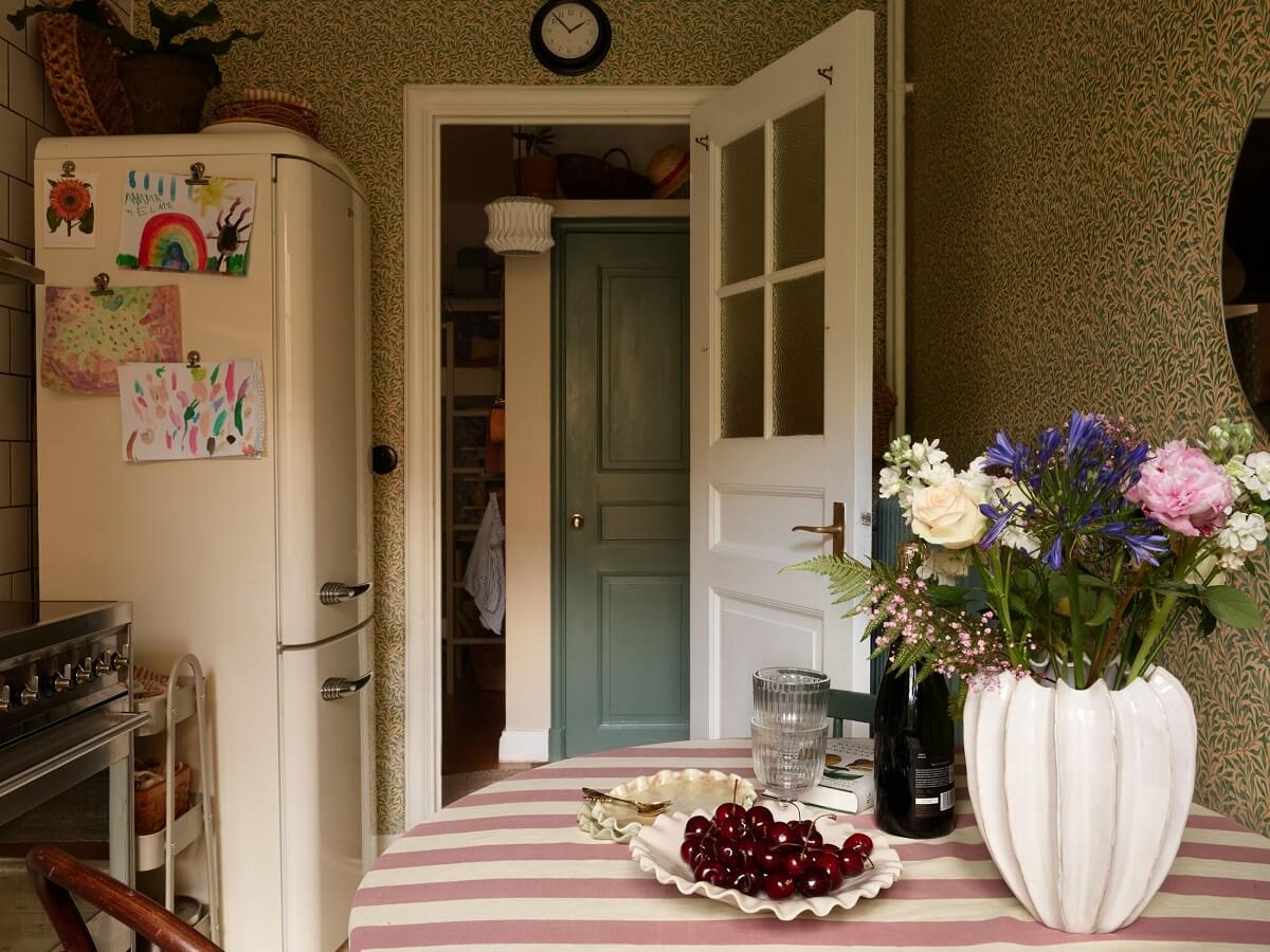 A Cozy 1920s Apartment with Original Details and Wallpaper 17 kitchen vintage striped table cloth