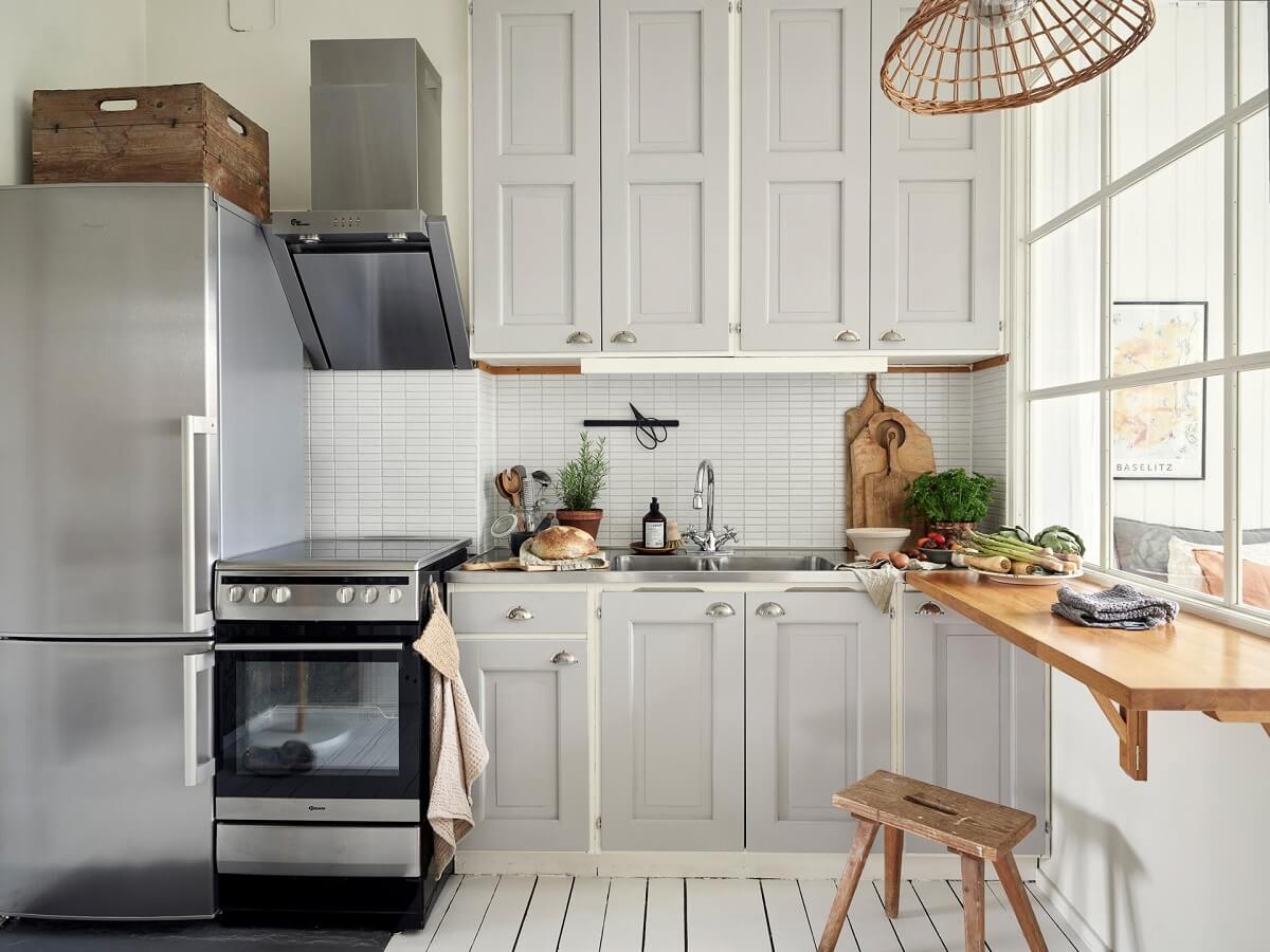 A Small Apartment with a Bright Open-Plan Kitchen & Bedroom 3 kitchen white floor light gray cabnets