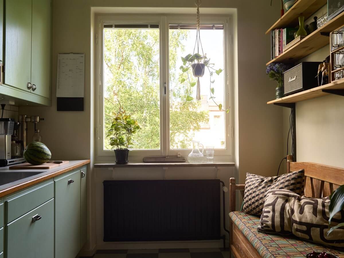 A Charming and Cozy Midcentury Family Apartment in Sweden 13 kitchen with bench seating nordroom