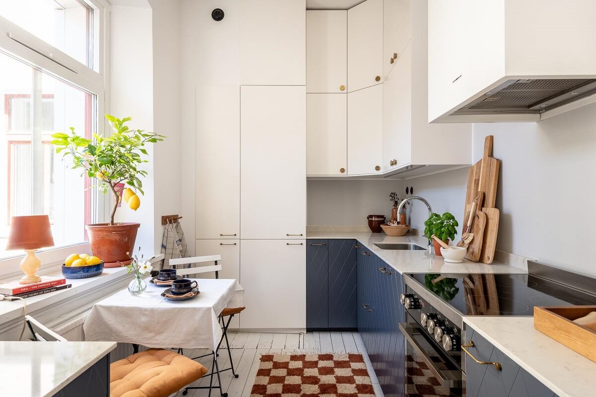 Warm, Neutral Colors in a Lovely Swedish Apartment 10 kitchen with blue and white cabinets