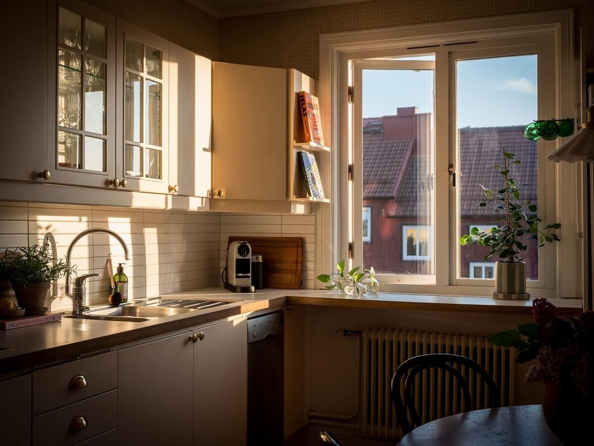 A Beautiful Renovated Maisonette Home with a Calm Color Palette 11 kitchen with evening sun