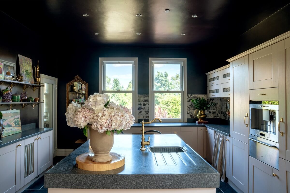 A Beautiful Edwardian House with Period Features 8 kitchen with pink cabinets and black eiling