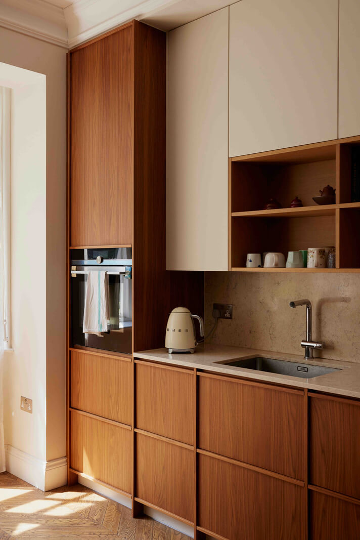 An Apartment with Rich Colors and Modern Design in a Victorian Mansion 4 kitchen with white upper cabinets nordroom