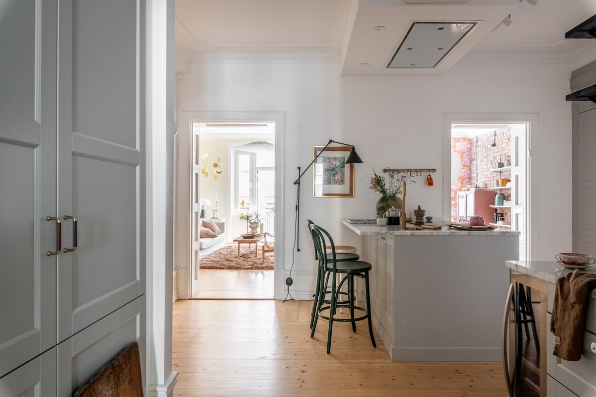 A Scandinavian Apartment with a Pale Yellow Living Room 16 kitchen