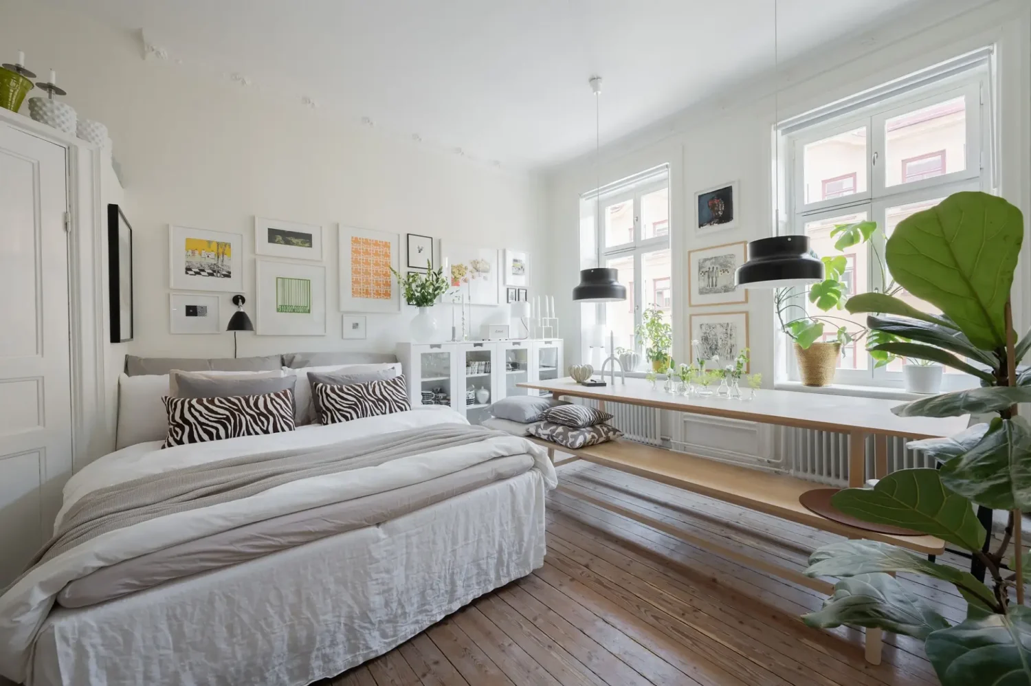 A Small Bright Scandinavian Studio Apartment 2 large bed and table in studio