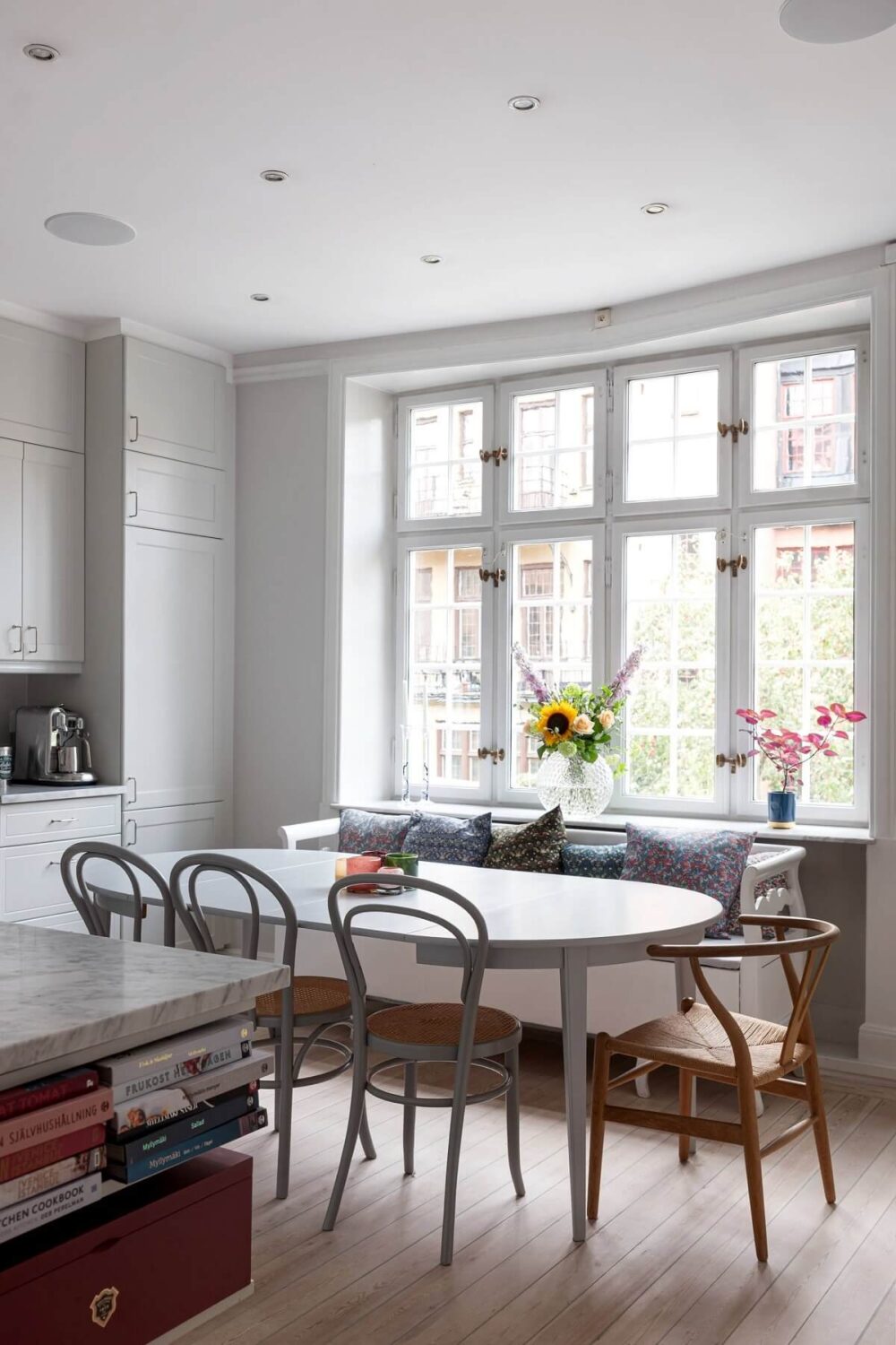 A Classic Apartment with a Blue Living Room 17 large kitchen table thonet chairs nordroom